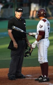 Baseball player arguing with umpire