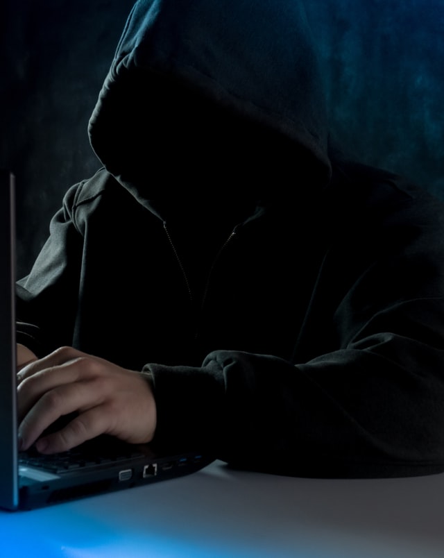 hacker in hoodie Your Facebook Account Has Been Hacked